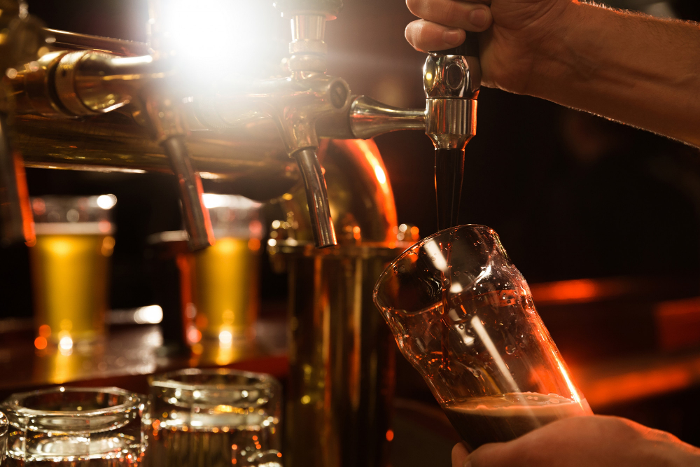 Bartender pouring a beer.