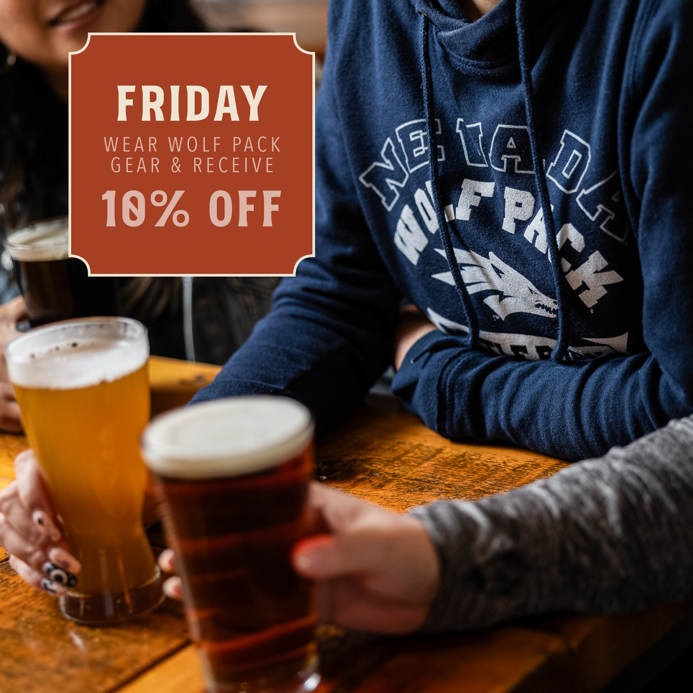 An individual wearing Nevada Wolf Pack gear while holding a beer. Text on the left says "Friday. Wear wolf pack gear a receive 10% off"